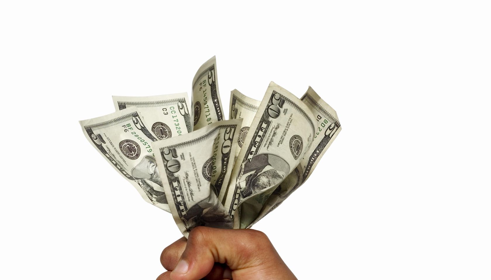 close up view of a hand holding bank notes