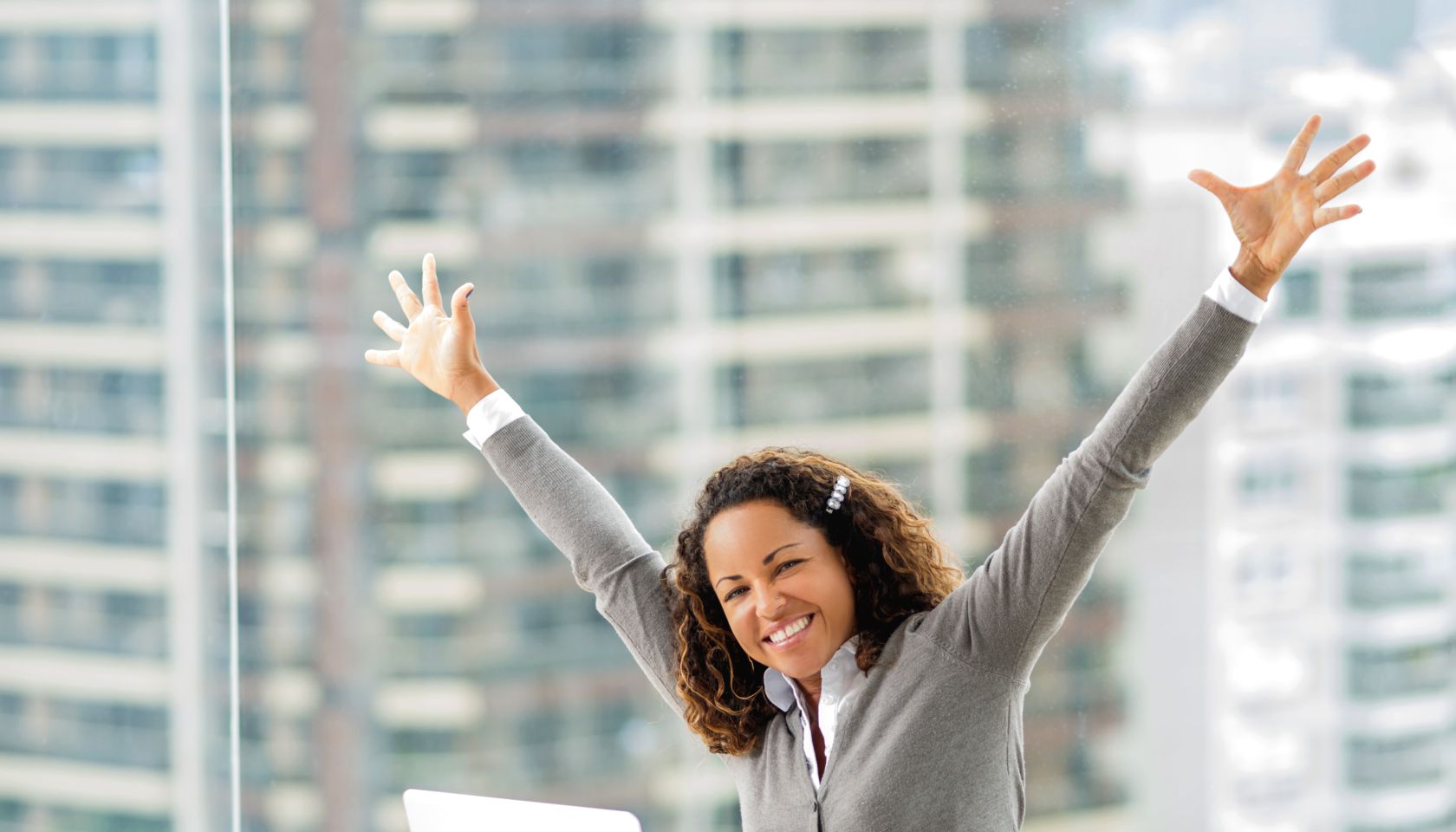 Successful African American businesswoman celebrating her succes.