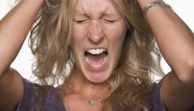 Woman pulling her hair and screaming