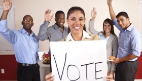 Mixed Ethnic Group of Young Adults with Vote Sign