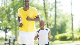 Father and son jogging together.