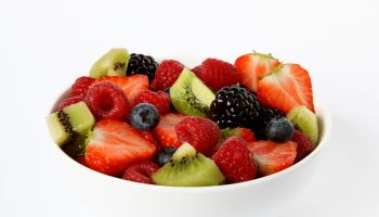 Bowl of fresh soft fruits and berries.