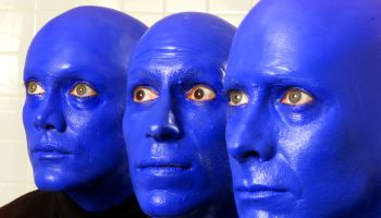BLUE MAN GROUP is a trio of performance artists who perform with their heads painted blue. They've b