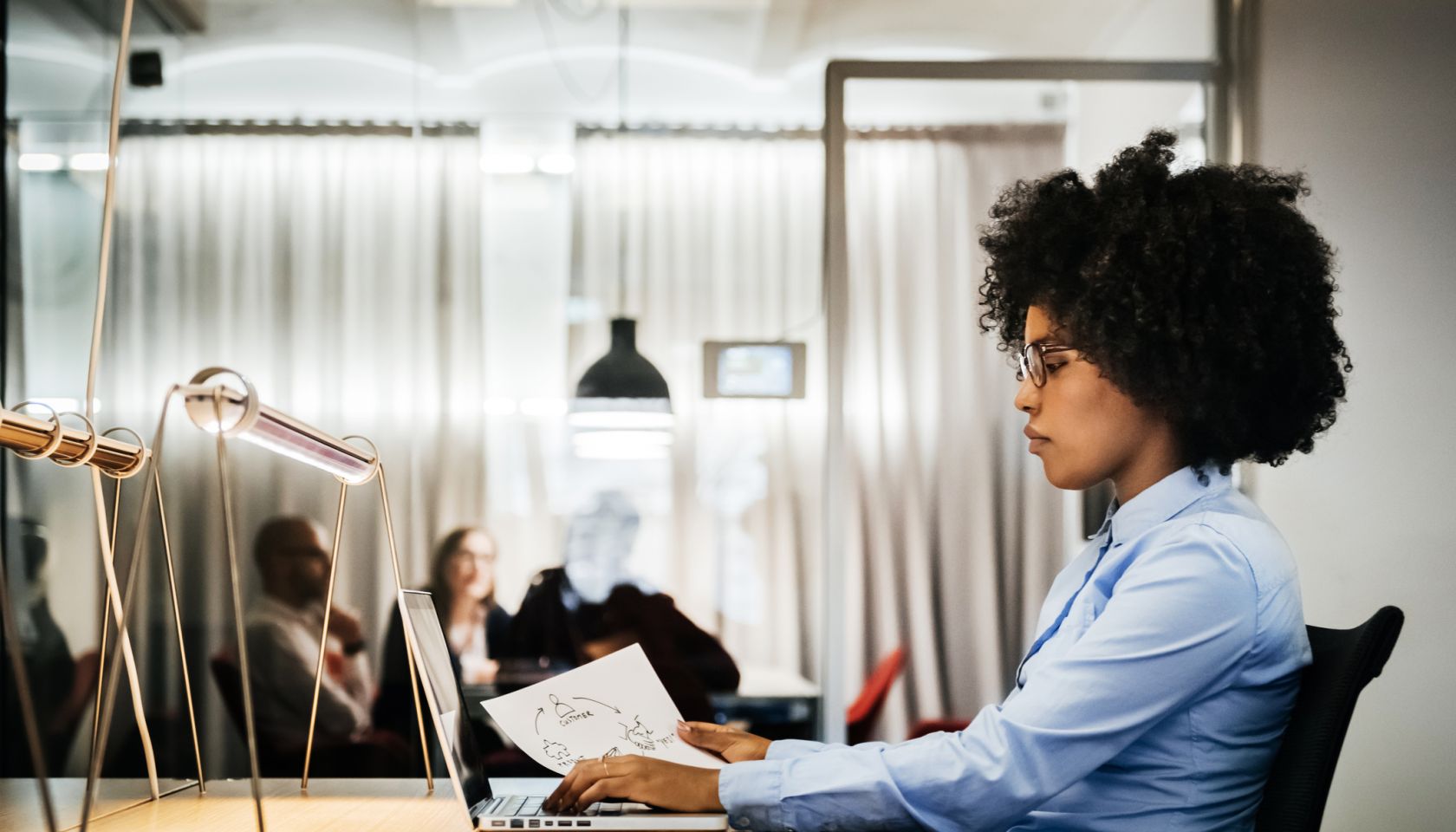 Young black businesswoman working in office