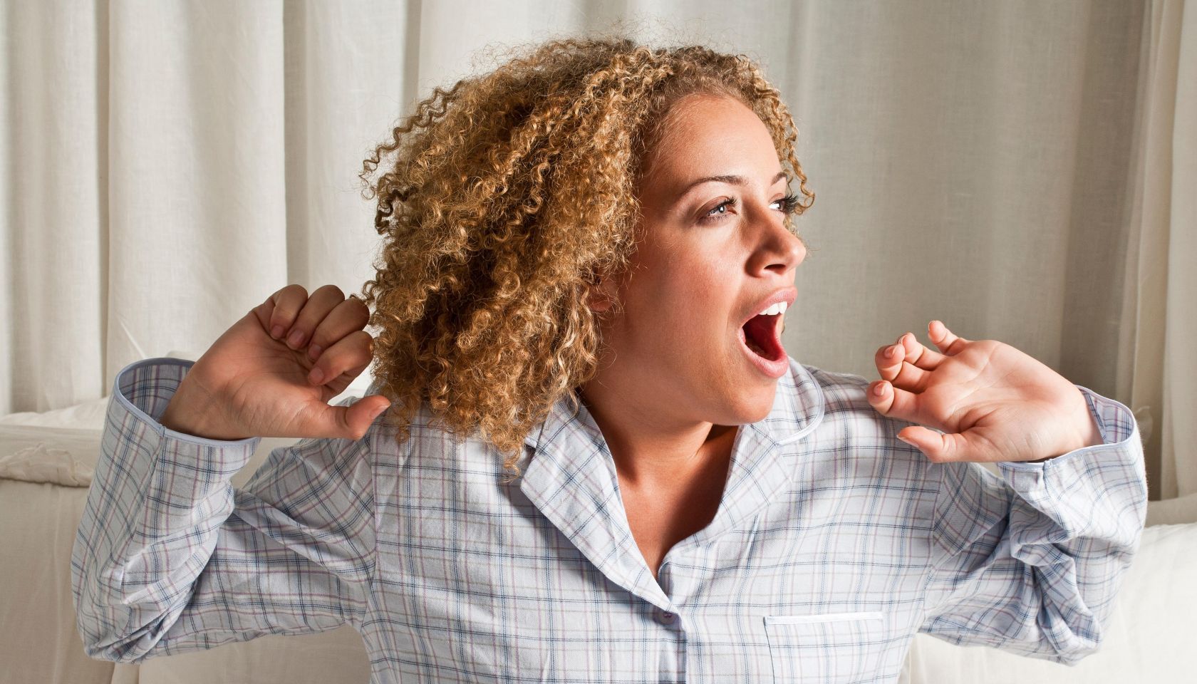 Woman stretching and yawning