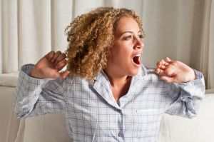 Woman stretching and yawning