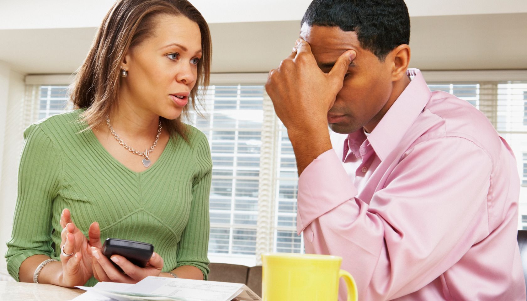 Couple Talking Over Bills