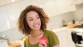 Healthy eating woman holding an apple