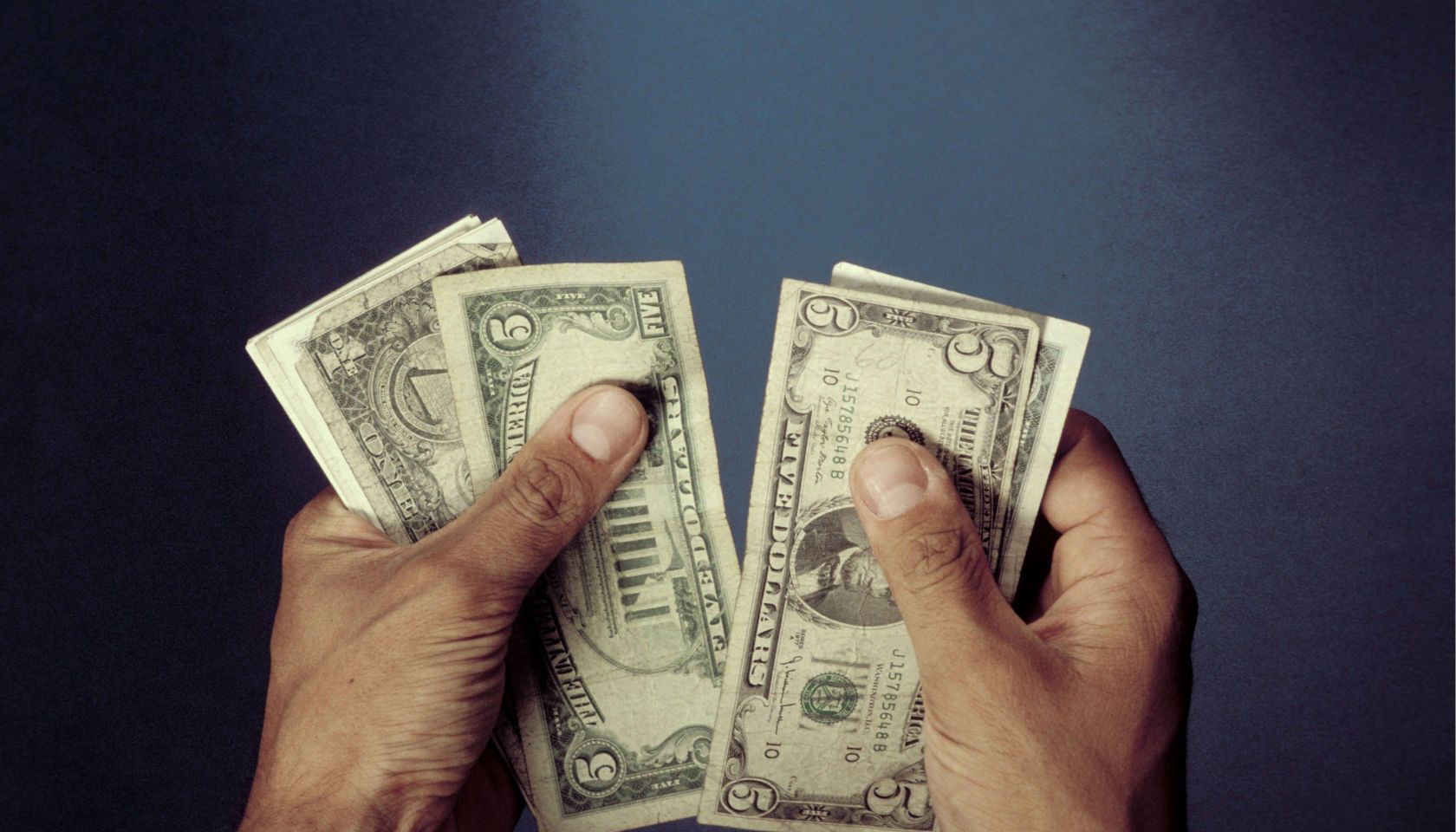 Hands with US - Dollars.