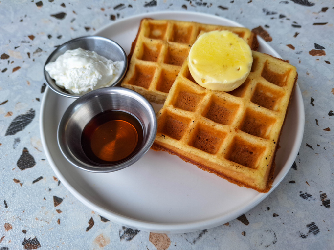 Serving Of The Classic Waffle With Butter, Cheese Cream And Maple Syrup. Dessert Food Menu.