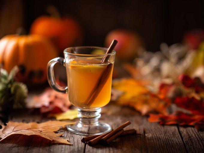 Glass Mug of Hot Apple Cider with Cinnamon Sticks