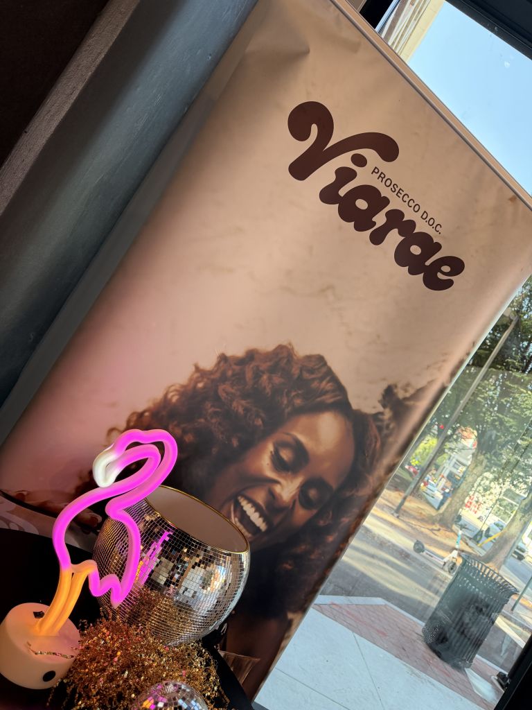 A bottle of Prosecco D.O.C. wine with the brand name "2i'amare" prominently displayed on the label. The label features an image of a person with curly hair.
