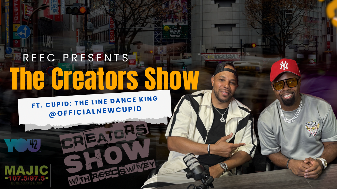 Two men posing for a photo, one wearing a Yankees cap and the other a white jacket. Text overlay reads "REEC PRESENTS The Creators Show ft. CUPID: THE LINE DANCE KING @OFFICIALNEWCUPID".