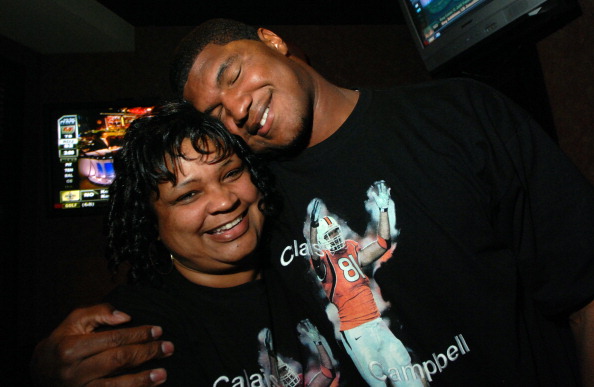 (HC) Calais Campbell- Former Denver South star player Calais Campbell of University of Miami, right, celebrates his draft pick from Arizona Cardinals with his mother Nateal at ESPN Zone in Denver on Saturday. The Denver Post / Hyoung Chang